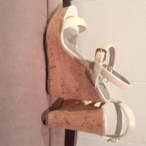 Report patent leather wedges